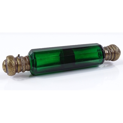 103 - A Victorian Bristol Green facet-cut glass double-ended perfume bottle, with gilt-brass tops, length ... 