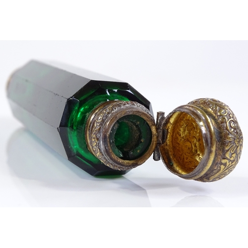 103 - A Victorian Bristol Green facet-cut glass double-ended perfume bottle, with gilt-brass tops, length ... 