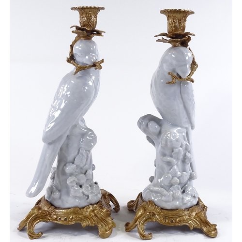 111 - A pair of white glaze porcelain parakeet candle holders, with ornate gilt-metal mounts, height 36cm