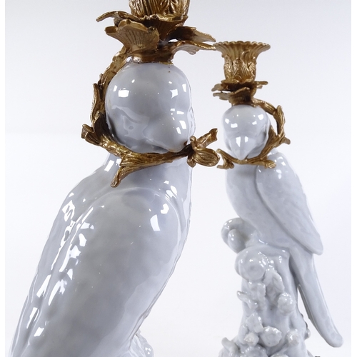 111 - A pair of white glaze porcelain parakeet candle holders, with ornate gilt-metal mounts, height 36cm