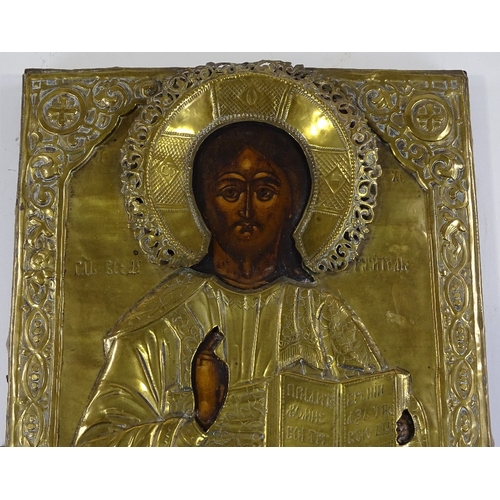 116 - An Antique Russian or Greek embossed brass-framed icon, 44cm x 37cm