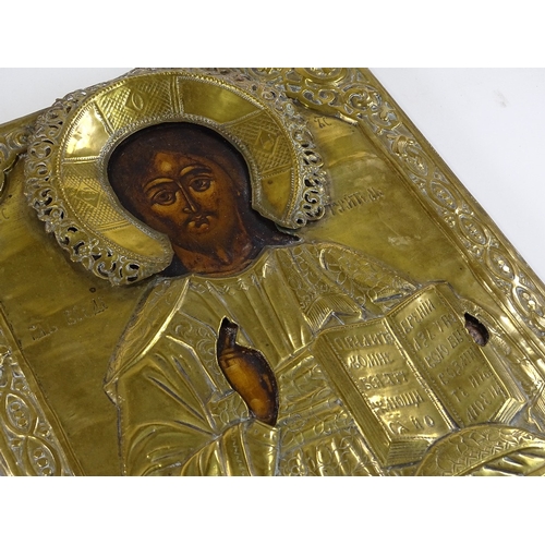 116 - An Antique Russian or Greek embossed brass-framed icon, 44cm x 37cm