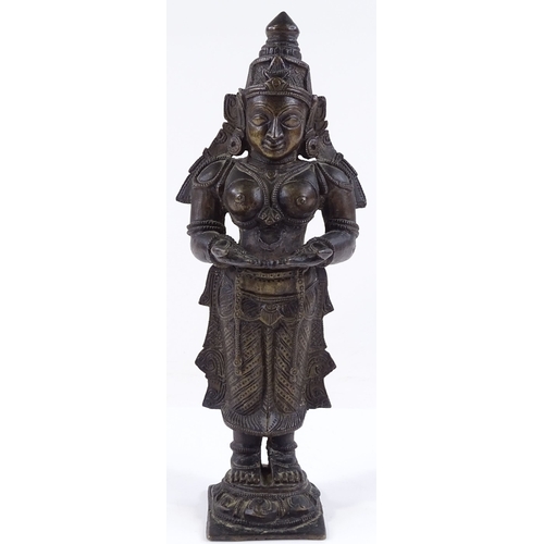 117 - An Antique Indian patinated bronze standing figure of a god, height 24cm