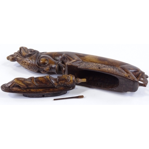 121 - A late 19th century Sumatran carved wood container, in the form of a mystical creature, length 19.5c... 