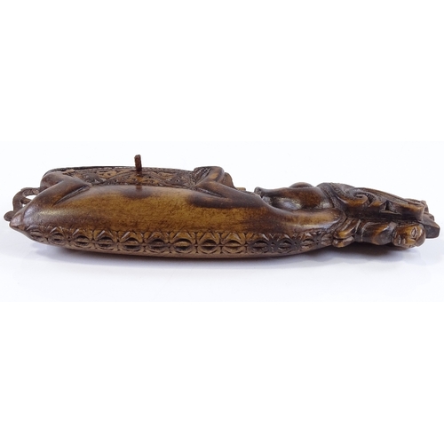 121 - A late 19th century Sumatran carved wood container, in the form of a mystical creature, length 19.5c... 