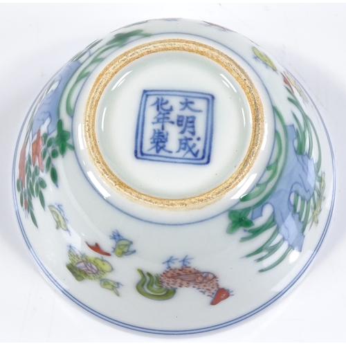 122 - A Chinese doucai enamel chicken cup, with 6 character mark, height 4cm, diameter 8cm