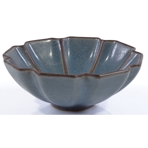 123 - A Chinese blue ground porcelain lotus design bowl, diameter 12.5cm