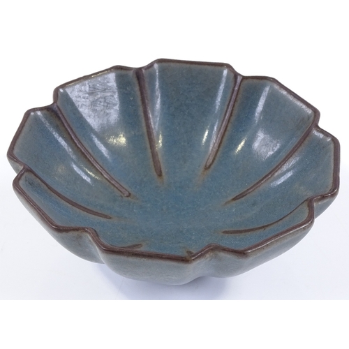 123 - A Chinese blue ground porcelain lotus design bowl, diameter 12.5cm