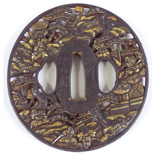 13 - An Antique Japanese bronze patinated iron tsuba, finely detailed, relief moulded battle scenes, with... 
