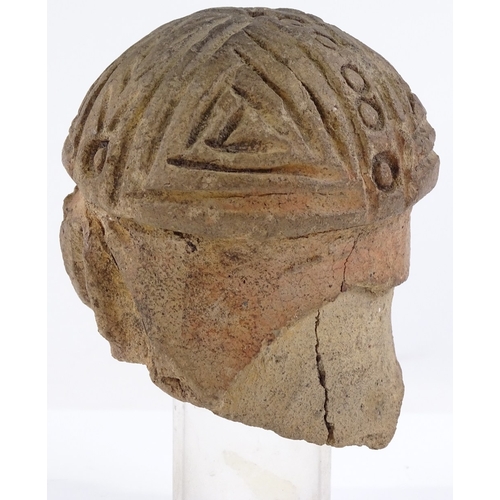 130 - A terracotta antiquity head sculpture, height 9cm