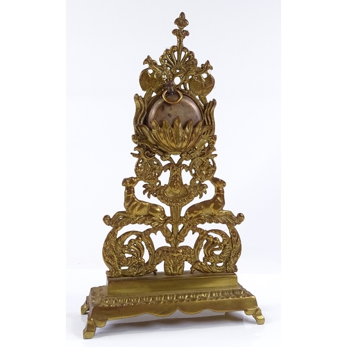 26 - A 19th century gilt-brass pocket watch stand, with greyhound design, containing a silver-cased pocke... 