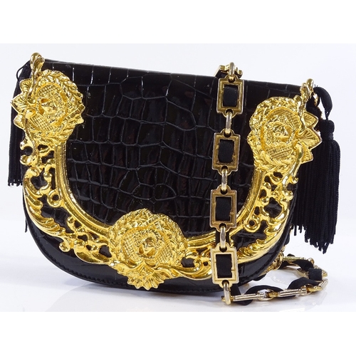 66 - A Gianni Versace couture patent lizard skin evening bag with gilt-metal mounts, length 18cm