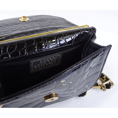 66 - A Gianni Versace couture patent lizard skin evening bag with gilt-metal mounts, length 18cm