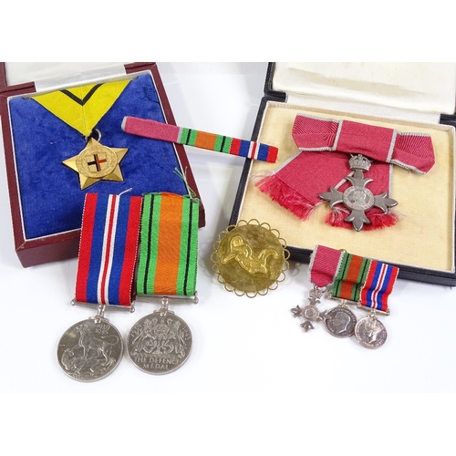 70 - An MBE group of 3 Second War Service medals and miniatures, together with the Most Excellent Order o... 