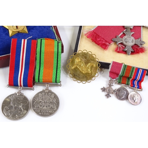 70 - An MBE group of 3 Second War Service medals and miniatures, together with the Most Excellent Order o... 