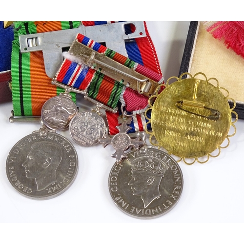 70 - An MBE group of 3 Second War Service medals and miniatures, together with the Most Excellent Order o... 