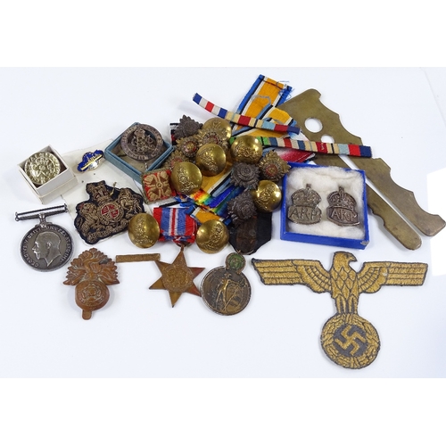 78 - A collection of military medals, badges, buttons and ribbons