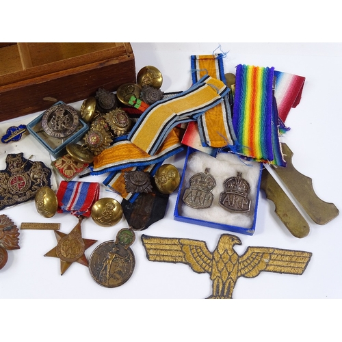 78 - A collection of military medals, badges, buttons and ribbons