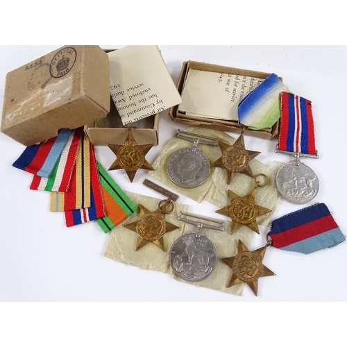 79 - 5 Second World War medals with Africa clasp, ribbons and papers, and 3 boxed Second War Period medal... 