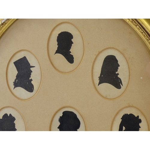 1140 - A set of 9 hand painted silhouettes, mounted in common gilt-gesso oval frame, overall dimensions 22