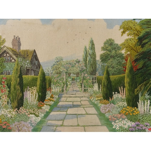 1298 - A finely detailed early 20th century embroidered picture, an English country garden, 19