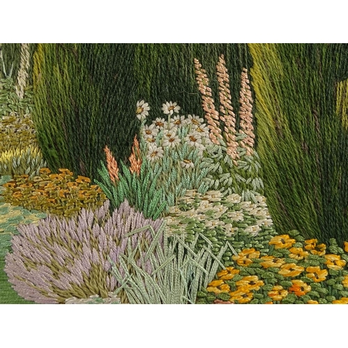 1298 - A finely detailed early 20th century embroidered picture, an English country garden, 19