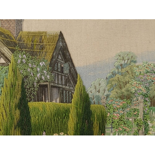 1298 - A finely detailed early 20th century embroidered picture, an English country garden, 19