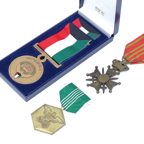 113 - An American Military Merit medal, and Iraq medal 1991, and a Belgian Cross (3)