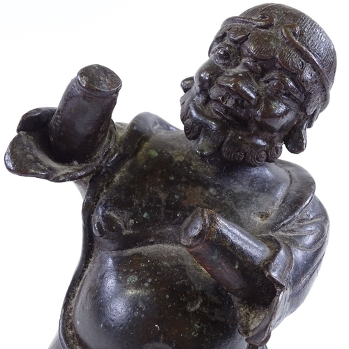 127 - An Antique Oriental patinated bronze kneeling figure, probably 18th or 19th century, height 23cm