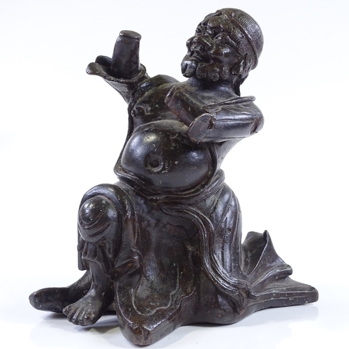 127 - An Antique Oriental patinated bronze kneeling figure, probably 18th or 19th century, height 23cm