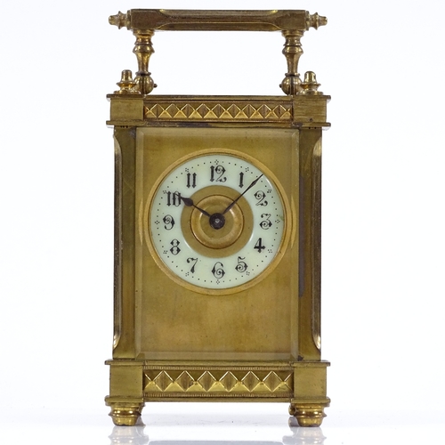 131 - A French brass-cased carriage clock with geometric bands, case height 11.5cm, working order