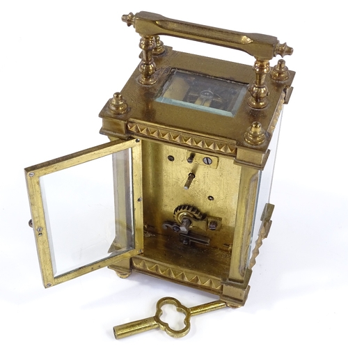 131 - A French brass-cased carriage clock with geometric bands, case height 11.5cm, working order