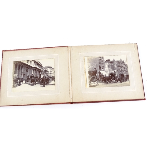 31 - A small album of original late 19th century photographs depicting London street scenes, album size 1... 