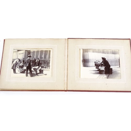 31 - A small album of original late 19th century photographs depicting London street scenes, album size 1... 