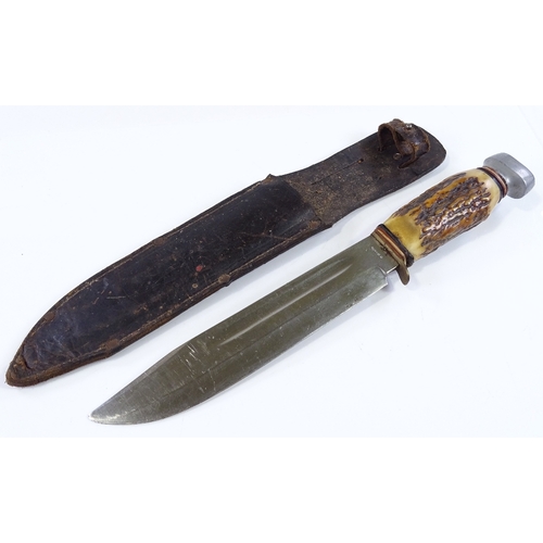 39 - A mid-20th century hunting knife, blade stamped R Bayer Solingen, with horn-handle and leather sheat... 