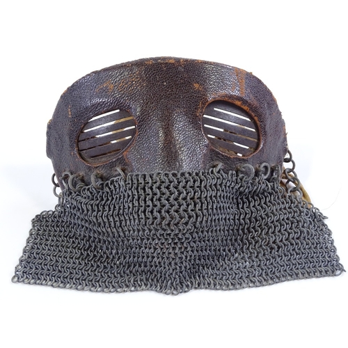 43 - A First War Period tank crew mask, leather covered steel upper part with chain link lower guard and ... 