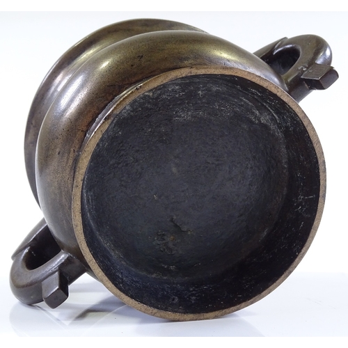 7 - A Chinese cast-bronze 2-handled incense burner with engraved geometric designs, rim diameter 12cm, h... 