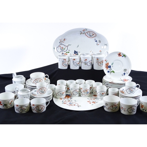 83 - A Limoges Christian Dior Imari pattern tea service, including 6 various jugs and 2 trays