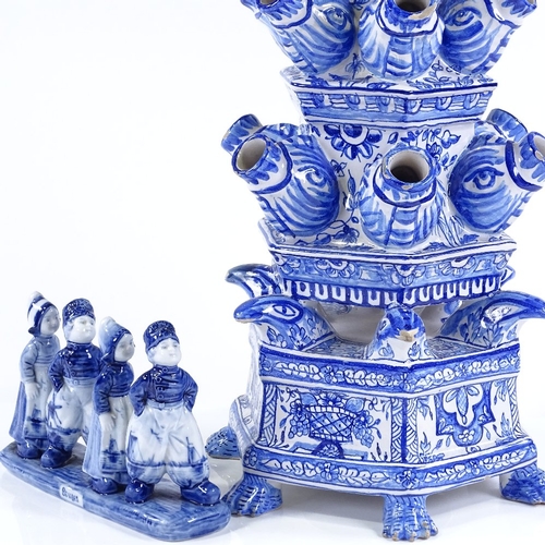 88 - A large Delft Pottery blue and white table centre flower stand, height 54cm, and a Delft group of ch... 