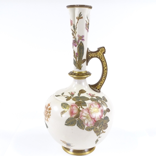 89 - A Royal Worcester ewer, with hand painted and gilded floral designs, and reticulated handle, pattern... 