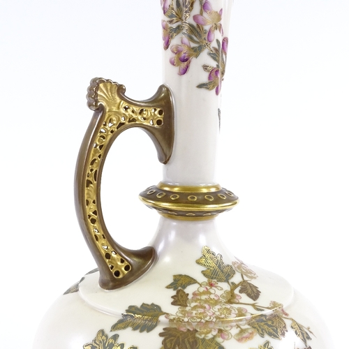 89 - A Royal Worcester ewer, with hand painted and gilded floral designs, and reticulated handle, pattern... 