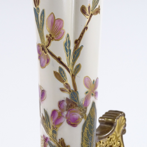 89 - A Royal Worcester ewer, with hand painted and gilded floral designs, and reticulated handle, pattern... 