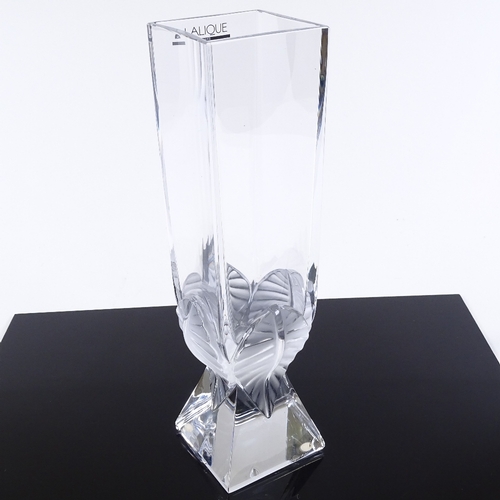 93 - A modern Lalique glass square-section vase, with relief moulded leaf decorated base, height 29cm, sm... 