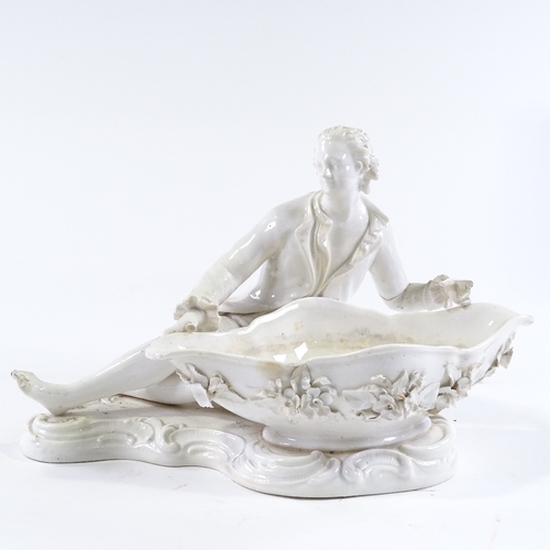 97 - A porcelain table centre basket, surmounted by a reclining figure, length 32cm, and 2 other Continen... 