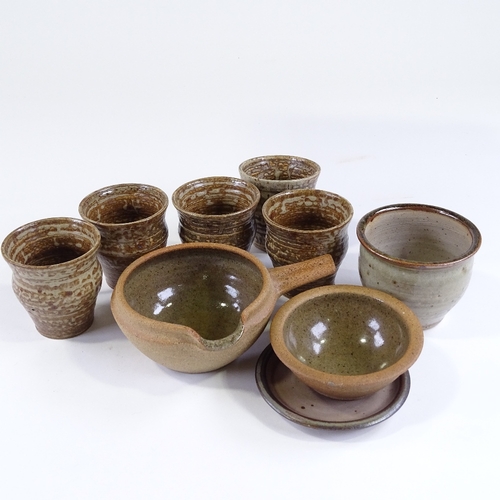 100 - Michael Leach, Yelland studio pottery, 5 beakers, height 8cm, a planter with saucer, and 2 pieces of... 