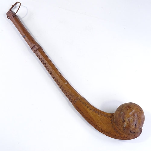 105 - A chip carved hardwood Tribal club, early to mid-20th century, length 53cm