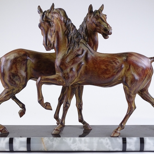 118 - An Art Deco style patinated metal sculpture of 2 horses, on 2-colour marble base, base length 70cm