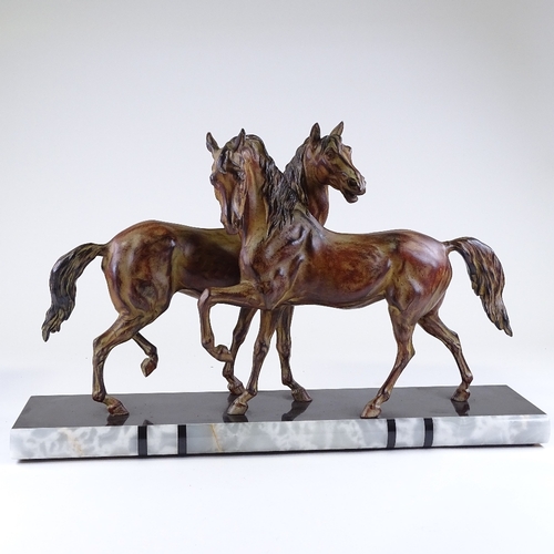 118 - An Art Deco style patinated metal sculpture of 2 horses, on 2-colour marble base, base length 70cm