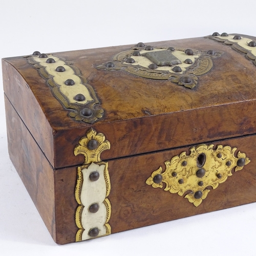 128 - A Victorian walnut dome-top jewel box, with ivory and brass mounts, and tray-fitted interior, width ... 