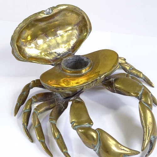 130 - A Victorian brass inkwell in the form of a crab, with rising lid and glass well, width 19cm